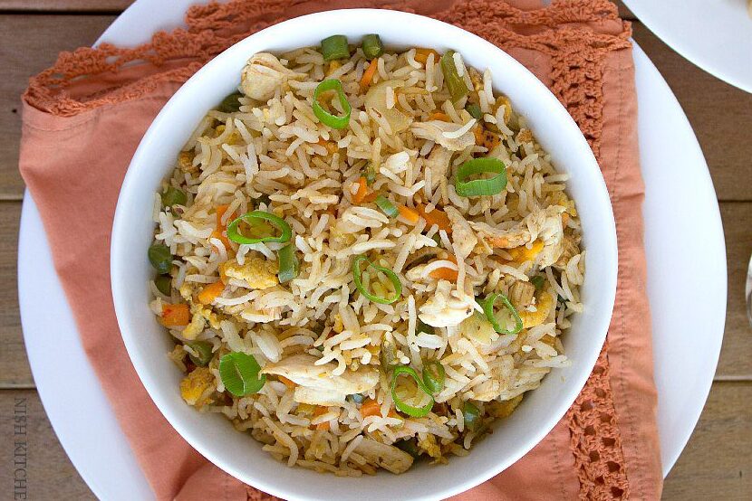 A bowl of vegetable pulao with rice and mixed vegetables.