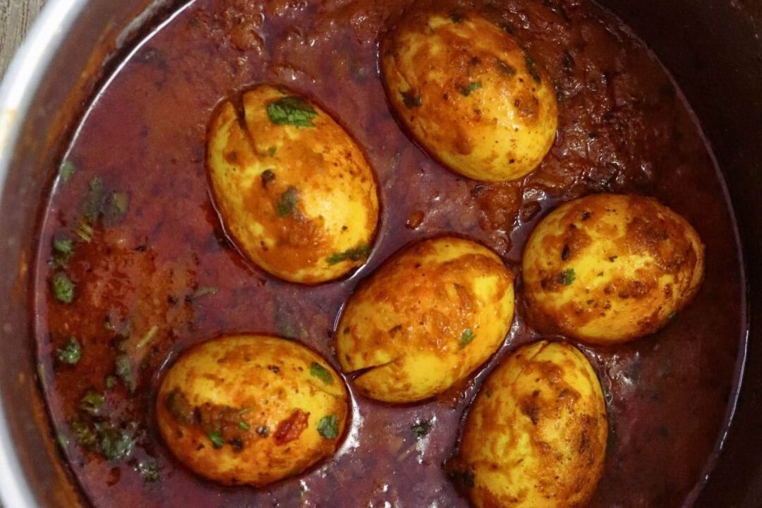 Spicy Indian egg curry with rich tomato gravy.