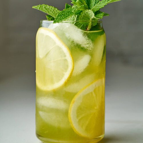 Refreshing lemon and mint iced drink in a glass.