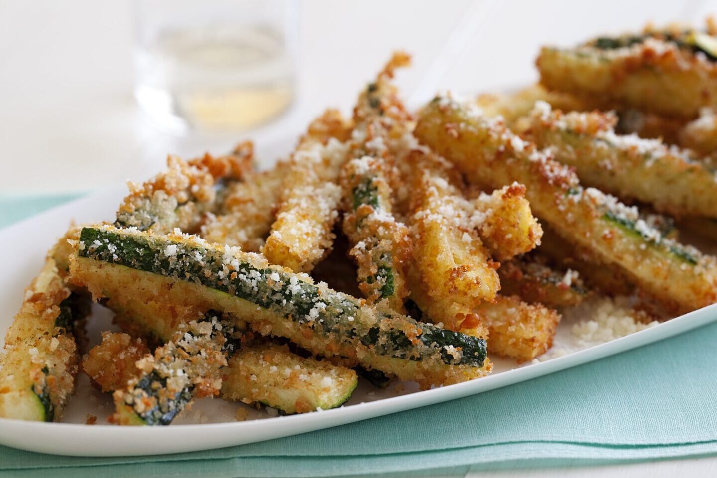 Crispy baked zucchini fries sprinkled with parmesan cheese.