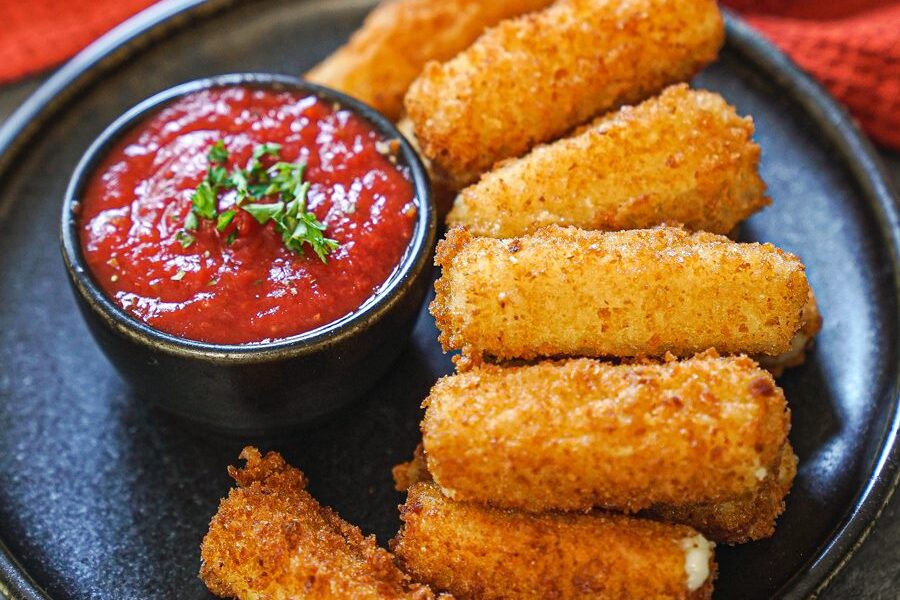 Crispy mozzarella sticks served with marinara sauce.