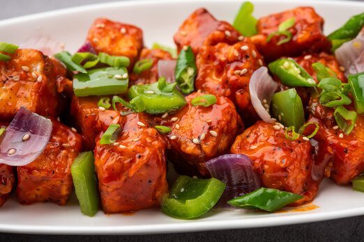 Spicy paneer tikka with green peppers and onions.